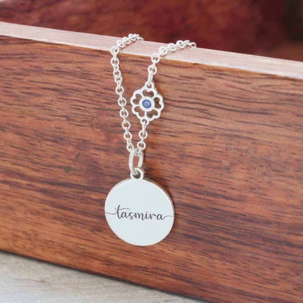 The Engraved Name & Flower Birthstone Connector Necklace makes a lovely present for a daughter, sister, or niece