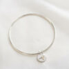 ENGRAVED COIN & PEARL CHARM BANGLE Pearl Bangle by Silvery South Africa